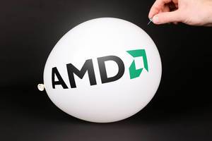 Hand uses a needle to burst a balloon with AMD logo