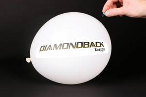 Hand uses a needle to burst a balloon with Diamondback Energy logo
