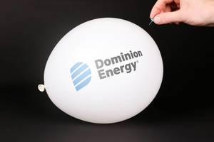 Hand uses a needle to burst a balloon with Dominion Energy logo