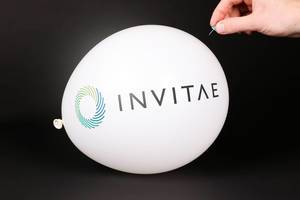 Hand uses a needle to burst a balloon with Invitae logo