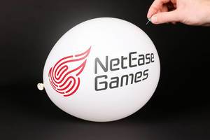 Hand uses a needle to burst a balloon with NetEase logo