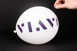 Hand uses a needle to burst a balloon with Viavi Solutions logo