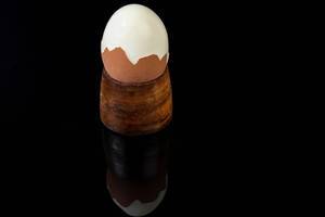Hard Boiled Egg above black reflective background (Flip 2019)
