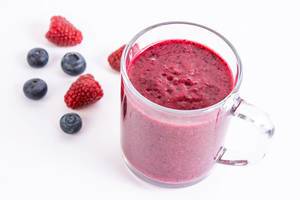 Healthy Blueberries and Raspberries juice in the glass