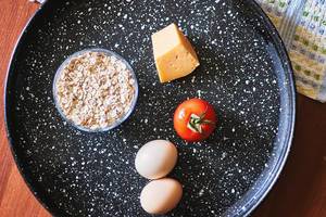 Healthy food - a cheese, oatmeal, tomato and eggs (Flip 2020)