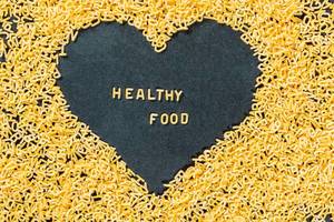Healthy food inscription on the background of a heart of letters