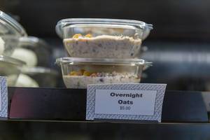 Healthy food to go: overnight oats in a plastic bowl to take away for breakfast