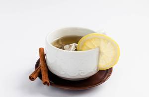 Healthy fruit tea with lemon and cinnamon