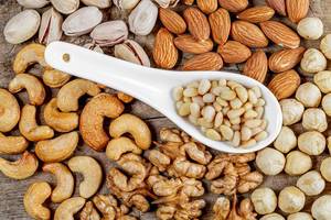 Healthy-snack-concept-nuts-on-a-wooden-background-top-view.jpg