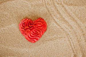 Heart on beach sand
