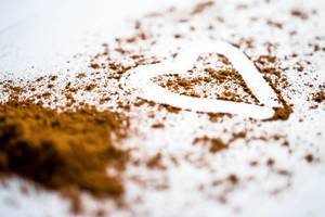 Heart traced over cinnamon powder