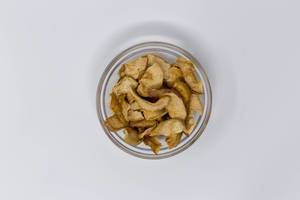 High Angle Shot - Dörrwerk - Apple Chips with Cinnamon in Glas Bowl on White Background