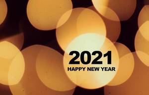 Hintergrundbild mit hellen, gelben Kreisen wünscht zum Neujahrsanfang ein Frohes Neues Jahr 2021