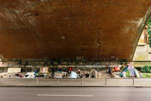 Homeless people built up their space below a bridge