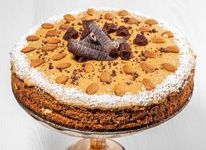 Homemade cake with condensed milk, chocolate, coconut and almonds