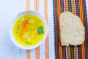 Homemade tripe soup served with white bread