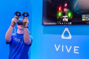 HTC Vive in action demonstrated with a game