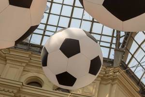 Huge soccer balls hanging from the ceiling