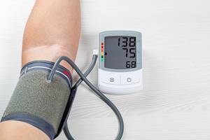 Human check blood pressure and heart rate with digital pressure gauge. Health care and Medical concept