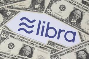 Hundred dollar banknotes around the Libra logo