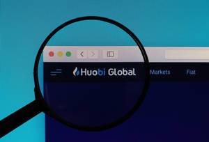 Huobi Global logo under magnifying glass