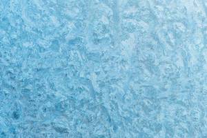 Ice pattern in light blue as an ideal background for topics such as winter, ice and snow