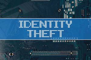 Identity Theft text over electronic circuit board background