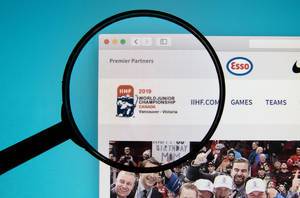 IIHF World Junior Championship logo on a computer screen with a magnifying glass
