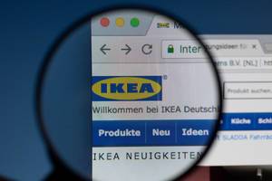 Ikea logo on a computer screen with a magnifying glass