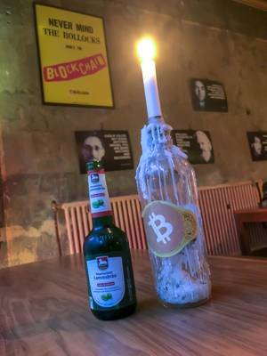 In the Bar Room 77 in Berlin Kreuzberg you can pay with Bitcoins for your beer, in front of "Never Mind The Bollocks/Blockchain" - Sex Pistols skit poster