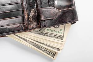In the black leather wallet dollars banknotes