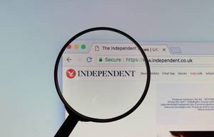 Independent logo on a computer screen with a magnifying glass