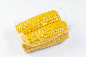 Isolated Cooked Young Corn on the white background (Flip 2019)