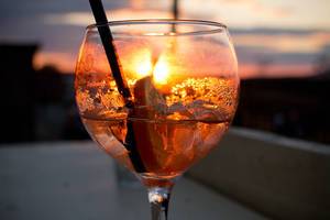 Italian Wine Based Cocktail Aperol Spritz with Sunset in the Background