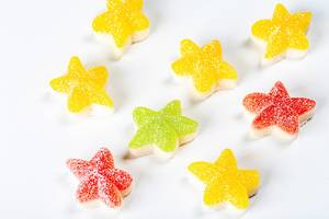 Jelly candies in the shape of stars on a white background (Flip 2020)