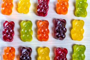 Jelly candy bears of different colors on a light background