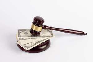 Judge gavel and money on white background