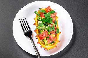 Kiwano with avocado, grapefruit and sunflower microgreen. Healthy eating concept