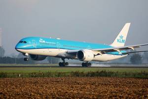 KLM plane touching down at Amsterdam Airport, AMS