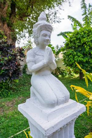 Kneeling Buddha Statue in Phnom Penh