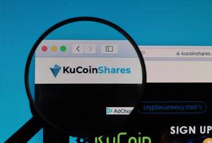 KuCoinShares logo under magnifying glass