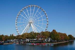 Landmark Wheel in the City with River