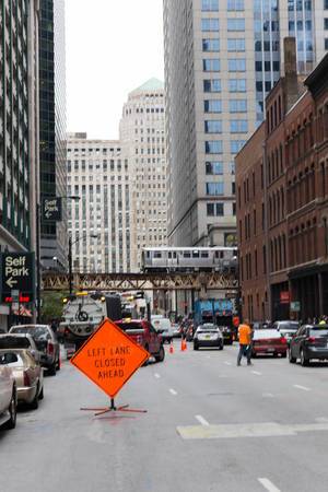 Left Lane Closed Ahead orange sign