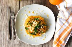 Lemon and Basil Spaghetti Squash on a plate and a wooden Table