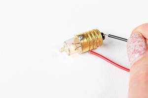 Light bulb in an electric circuit in a school scientific experiment (Flip 2020)