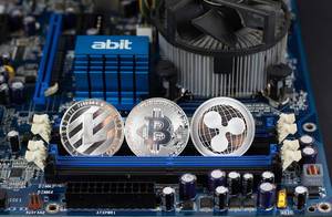 Litecoin, Bitcoin and Ripple on motherboard