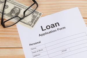 Loan Application Form on wooden table