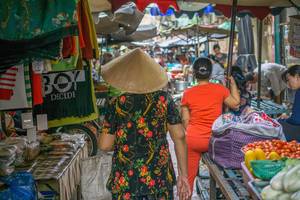 Local Woman walking around a Market in Ho Chi Minh City