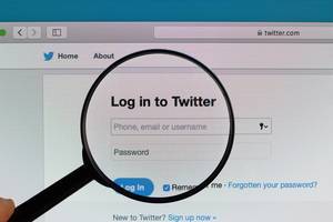 Log in to Twitter webpage under magnifying glass