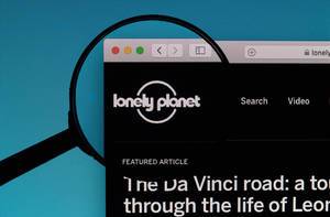 Lonely Planet logo under magnifying glass
